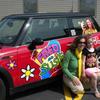 Part of the attraction was getting to have your picture taken with Susie and the MINI. Here a young fan poses with Susie for the photo op.