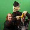 The Kevin puppet is our first "live hand" puppet on the show. That means that the puppeteers' hands are inside the puppet's hands. It takes two people to run Kevin, and here Chris and Karen operate him for the Good Banana song green screen shots. 
