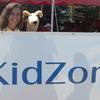 An hour before showtime, Susie arrived at the KidZone. It was a great relief to see here because I really didn't want to have to do the whole thing by myself! Here we are posing in front of the KidZone sign.