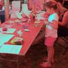 This fan and her mom are both making fish puppets. In addition to our fish craft project, we had coloring pages, puzzles, and a good supply of crayons available. Our craft table was busy all day long!